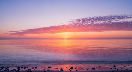 Serene ocean sunset with vibrant colors reflecting on calm water, creating a peaceful and breathtaking natural scene.