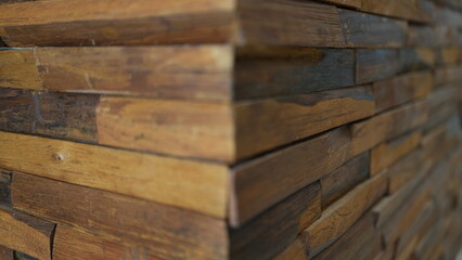 Corner detail of a wooden house structure, selective focus. Rustic timber elements of cabin...