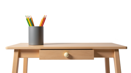 Wooden desk with drawer and gray pencil holder filled with colorful pencils, creating cozy workspace atmosphere