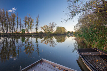 Boat on the Raba backwater in autumn, Gyirmot, Gyor, Hungary