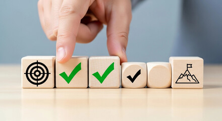 Wooden Blocks with Checkmarks and Target: Goal Achievement