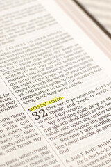 Obraz premium Moses' song text in open holy bible book. Christian praise, salvation, and worship of God Jesus Christ. Biblical concept.