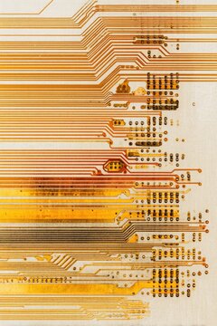 Close-up of intricate circuit board traces.  Parallel lines of gold and tan copper