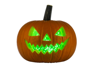 Pumpkin with LED lights glowing green inside, isolated
