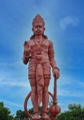 Massive Hanuman Statue Under Blue Sky