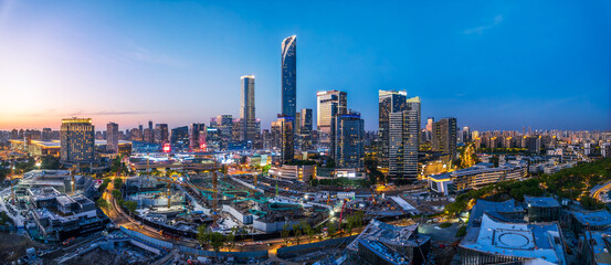 Obraz premium High angle view of a modern city financial district with skyscrapers at dusk in Suzhou, China.