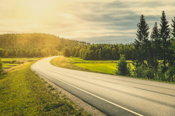 Winding road through the scenic landscape of Finland