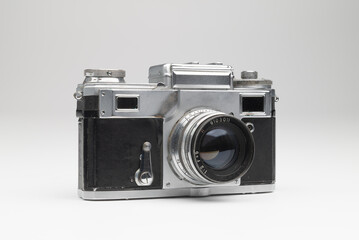 Old fashioned, antique film photo camera on white background