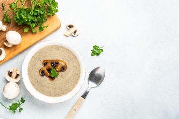 Mushroom soup puree on white kitchen table.