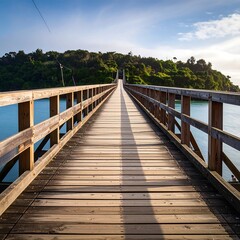 Fototapeta premium Wooden bridge spanning a tranquil body of water