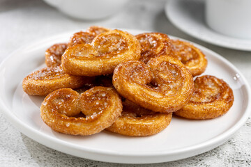 Tasty French Palmier Cookies Pastry. Palmiers or elephant ears.