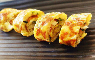 Japanese Tamagoyaki Egg Roll with Vegetables on Plate