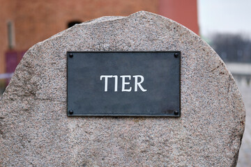 Local levels tighter restrictions and lockdown concept. TIER word written on the plaque of a large...