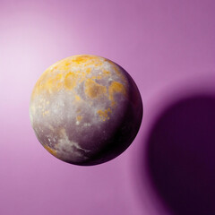 Venus, the second planet from the Sun, shown as a glowing sphere with a purple background