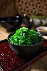 Seaweed salad,wakame salad, chuka wakame in black bowl
