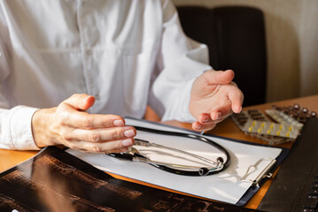 Healthcare professional taking notes in a clinical setting during a routine check-up