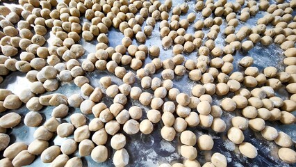 sea shells background dough, raw, unbaked, square, baking, pastry, homemade, food, ingredient, tray, texture, pattern, dessert, cooking, preparation, close-up, top view.