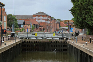 Obraz premium Historic Riverside Warehouses and Lock Gate