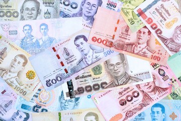 Thai baht currency money. The current banknotes lies on table in big amount
