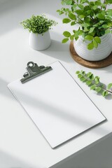 Blank clipboard mockup on a white desk with plants and sunlight.