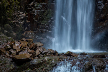 Waterfall Cascading over Rocky Cliff