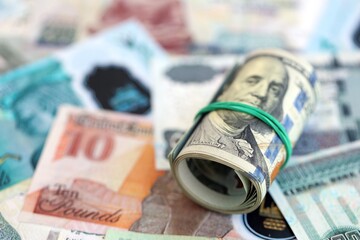 Egyptian pound currency money bills and bunch of us dollars. The concept of currency exchange