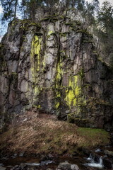 Moss-Covered Basalt Cliff with Stream