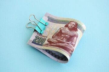 Egyptian pound money bills in big amount on blue. Finance and banking concept