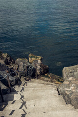 Rocky staircase down to the sea