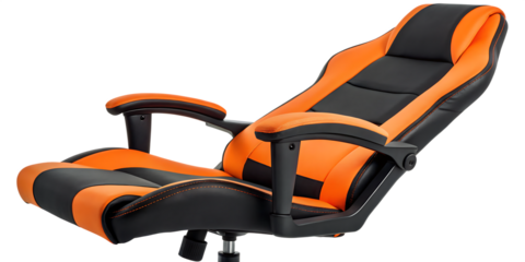 A close up view of an orange and black gaming chair against a black background in a studio shot