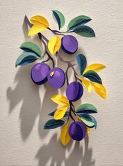 Paper plums on branch, vibrant colors