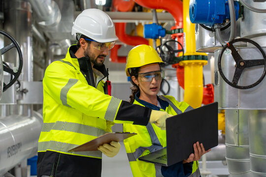 Industry professionals discussing HVAC improvement, automation, and operational safety at a construction or manufacturing site.