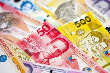Philippines peso currency money bills. The current banknotes lies on table in big amount close up