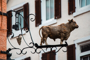 Mosbach, Germany. Wrought Iron Bull and Grapes Sign on Historic Building 