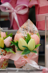 Handmade soap flowers: bouquets of roses wrapped in kraft paper