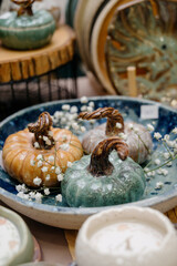 A set of decorative clay gourds with a twisted stem