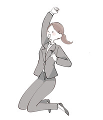 飛び上がってガッツポーズするスーツの女性