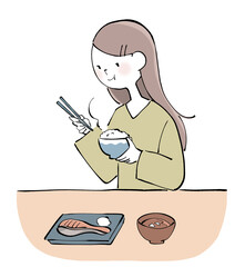 ごはんを食べる女性