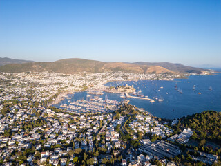 Bodrum, Turkey: Aerial view of the famous Bodrum beach town with its marina and ancient castle by the Aegan sea.