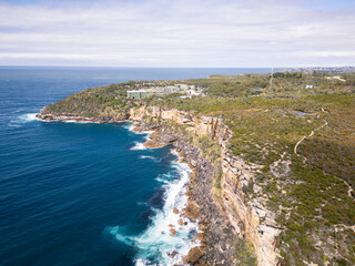 Sydney, Australia: Aerial view of the dramatic cliff of the Sydney Harbour National Park near Manly beach in Australia
