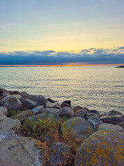 A Beautiful, Tranquil Seaside Sunset Over Calm and Serene Waters Reflects Natures Beauty