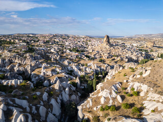 Ortahisar, Turkiye: Dramatic aerial view of the famous Ortahisar old town and ancient castle in the Cappadocia region of Turkey.