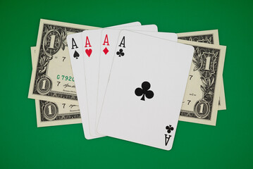 4 aces and dollars on green background, symbolizing casino games, gambling, and poker tournaments