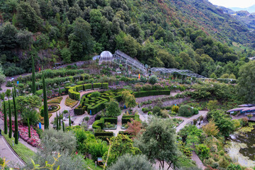 Gardens of Trauttmansdorff Castle panorama with flowers, trees and plants near Merano, South Tyrol, Italy