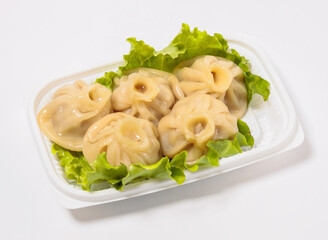 Xiao Long Bao Soup Dumplings in a Takeout Container on Lettuce top view of japanese food