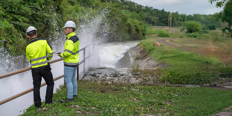 A engineering doing his checking routine. He is wearing hard hat and engineer uniform.Standing by...