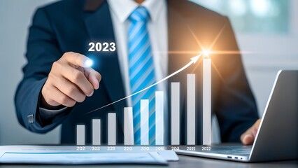 Business growth chart with a man pointing to the 2023 year, indicating positive financial trends and success.