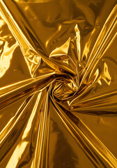 Shiny Gold Metallic Foil Texture Abstract Swirl, Wrinkled Surface, Golden Fabric, Background, Luxury, Elegant.