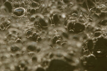 soap bubbles on a yellow background