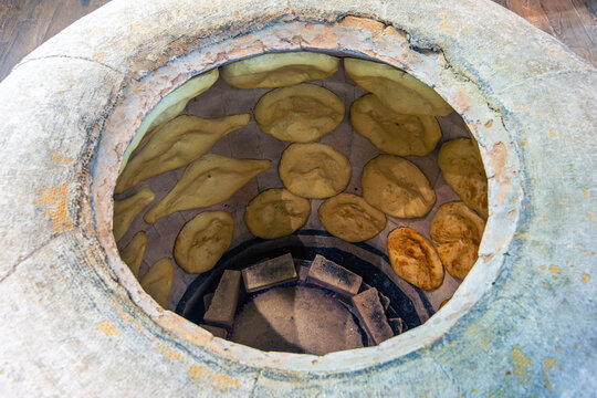 Shotis Puri bread inside clay oven tonir, traditional Georgian bakery